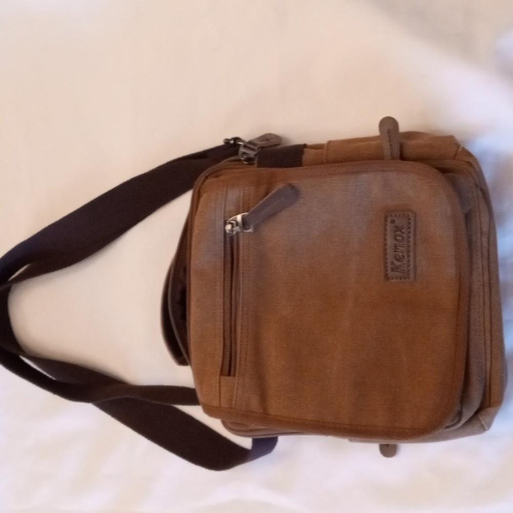 Kenox Men's multifunctional canvas messenger bag.
